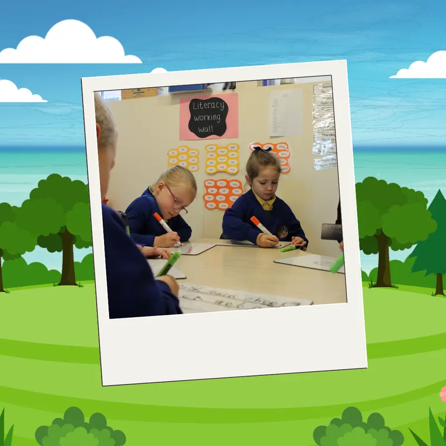 Pupils developing literacy skills in the classroom at Ysgol Bro Carmel